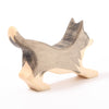 Wooden toy border collie in black with white markings on tail legs and snout | © Conscious Craft